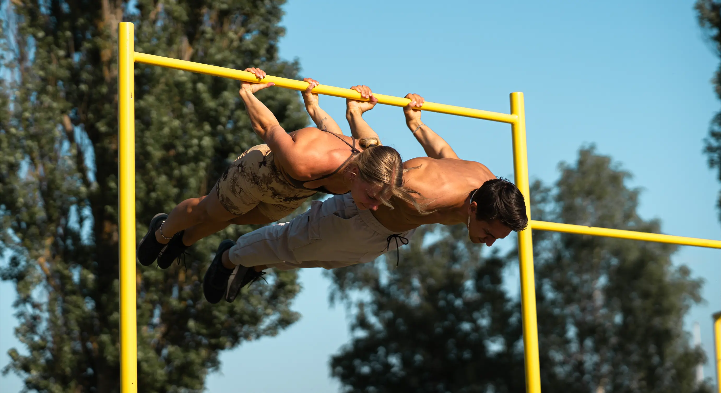 Daniel Flefil and Malin Malle doing a backlever in a calisthenics park