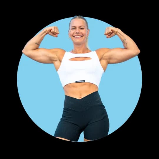 Calisthenics coach flexing her biceps